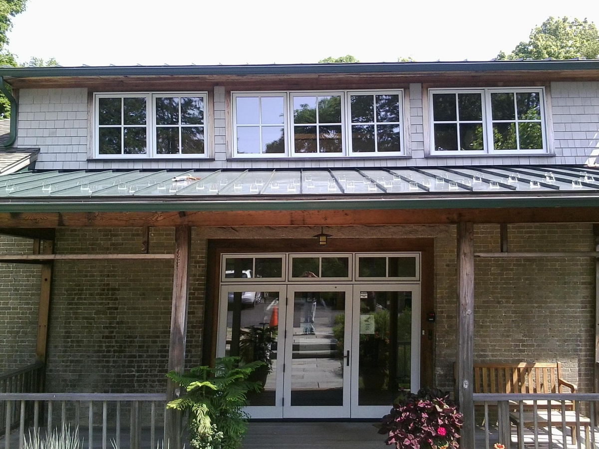 Aluminum gutters at entry roof in Woods Hole