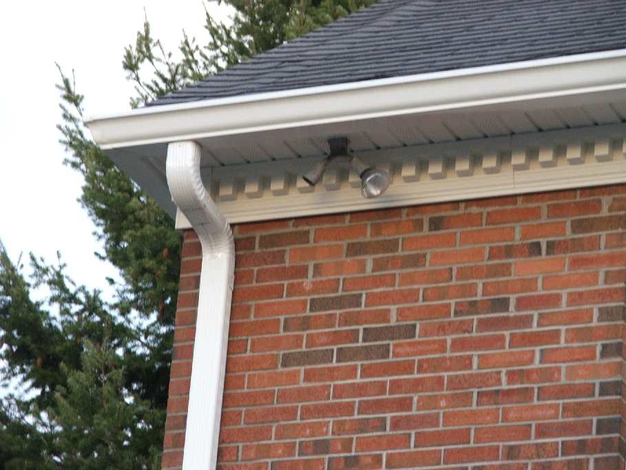 Gutter with mitered corner and downspout