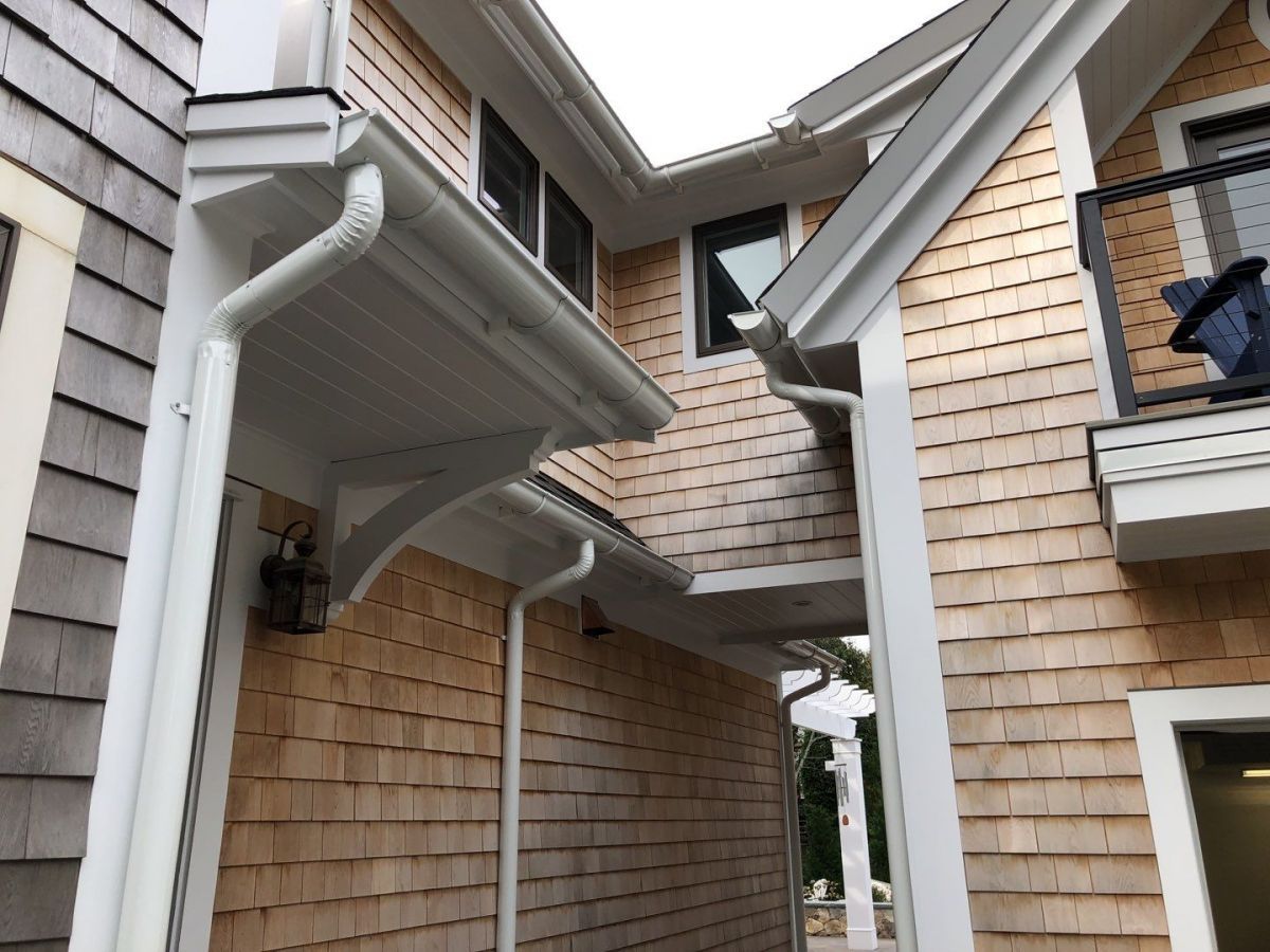 Seamless Half Round Gutter Installed with Stamped Brackets on Azek Wedges in Chatham