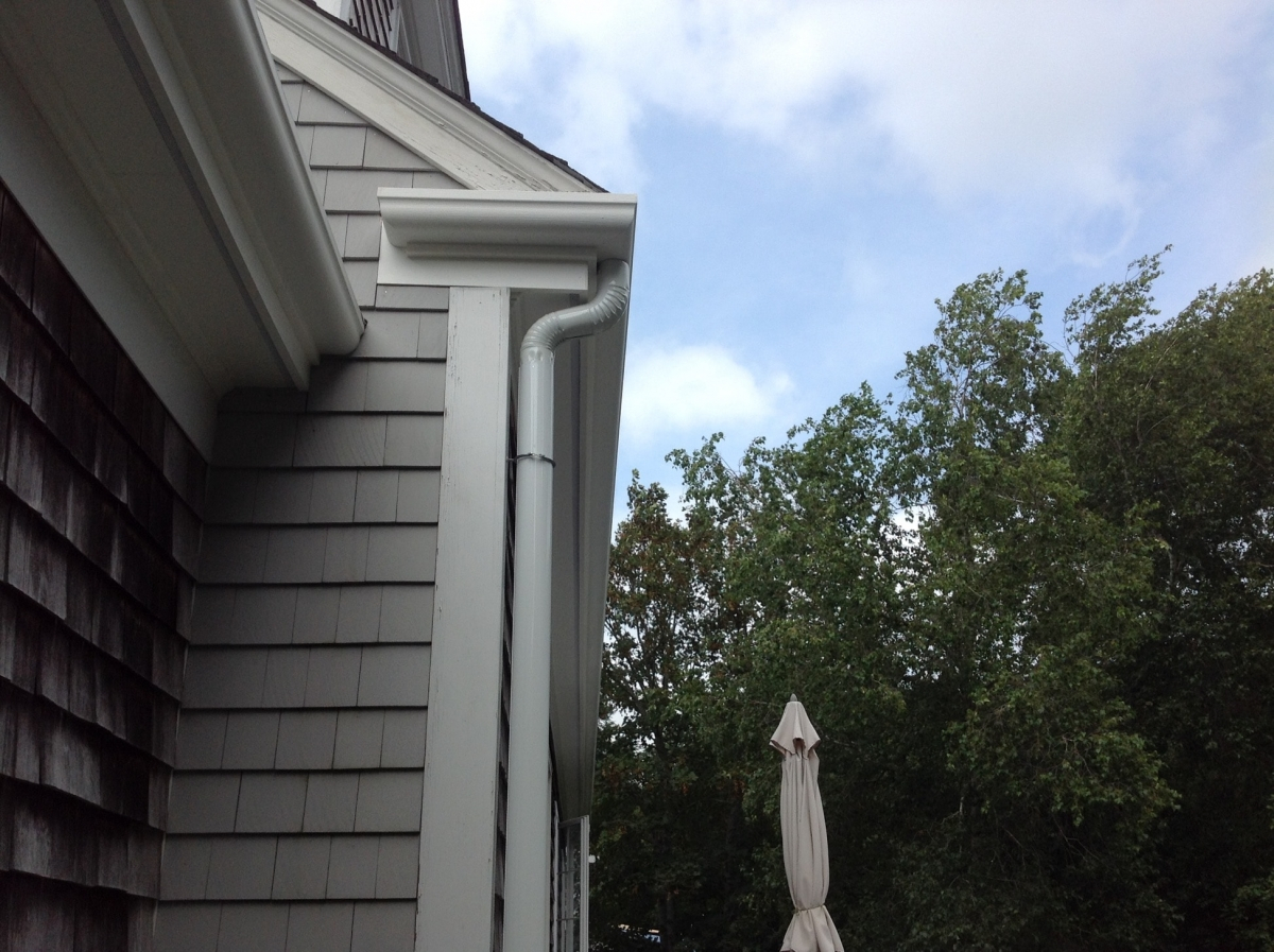 Fiberglass gutter with mitered return and aluminum downspout