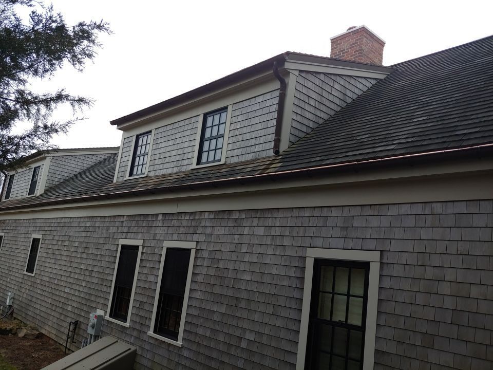 Half Round Copper Gutter installed across the rear of the home