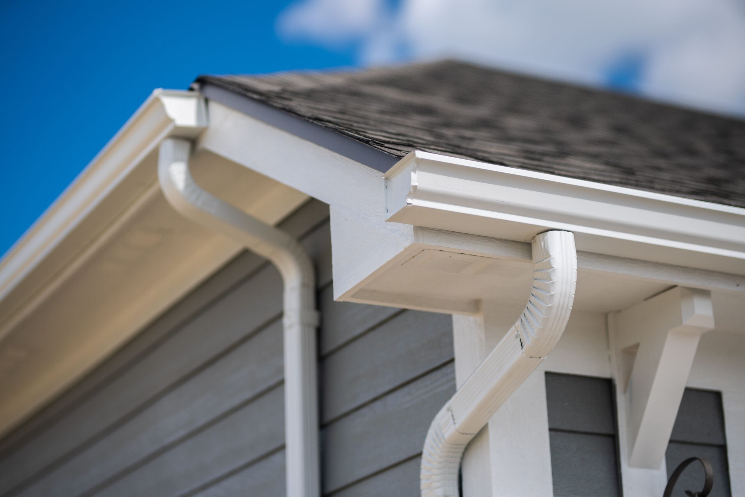 white gutter and downspout